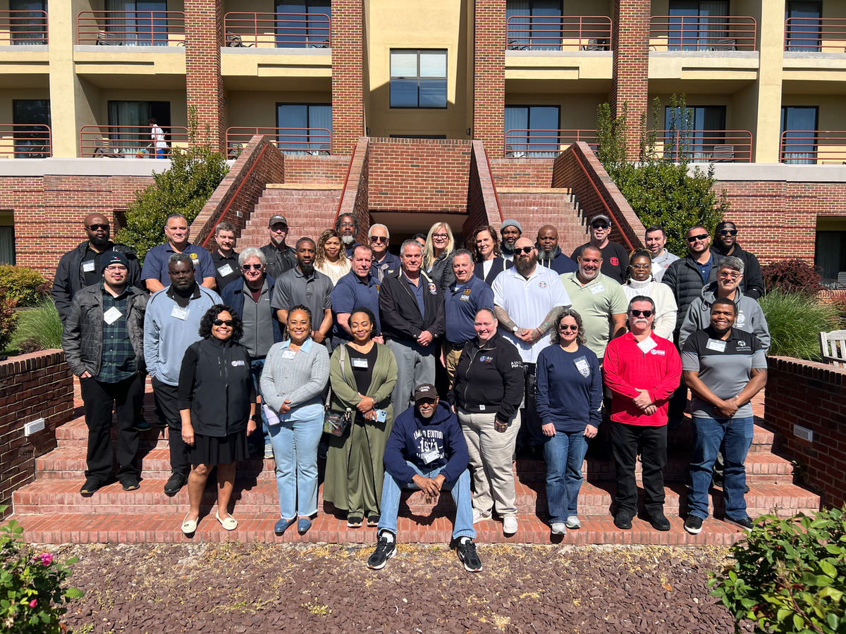 American and Spirit Airlines safety representatives gathered on the steps at the William W. Winpisinger Center (W3)